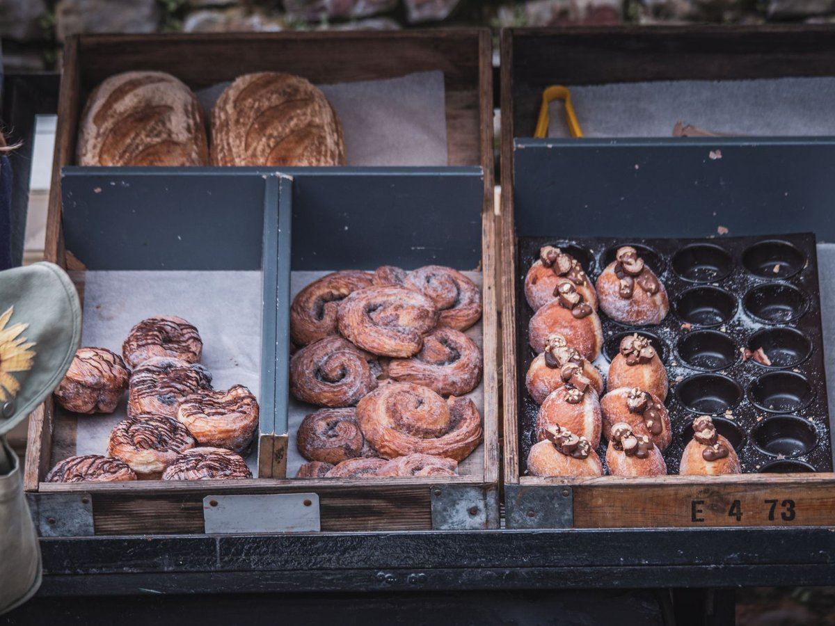 Artisan breads and pastries on a bakery display